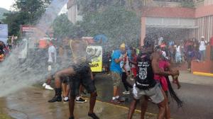Carnival-crazy at the University of the West Indies: revelers doused in water… (Twitter photos)