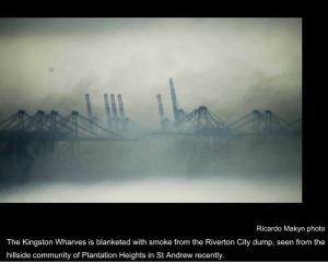 Kingston wharves blanketed in smoke. (Photo: Ricardo Makyn)