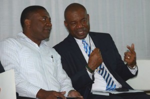 Minister of Science, Technology, Energy and Mining, Hon. Phillip Paulwell (left), is in discussion with Principal, Calabar High School, Albert Corcho, during a career exposition on March 10 at the school. (Photo: JIS)